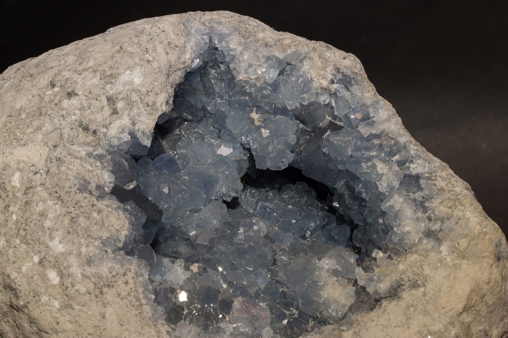 A large celestite geode lined with pale blue crystals